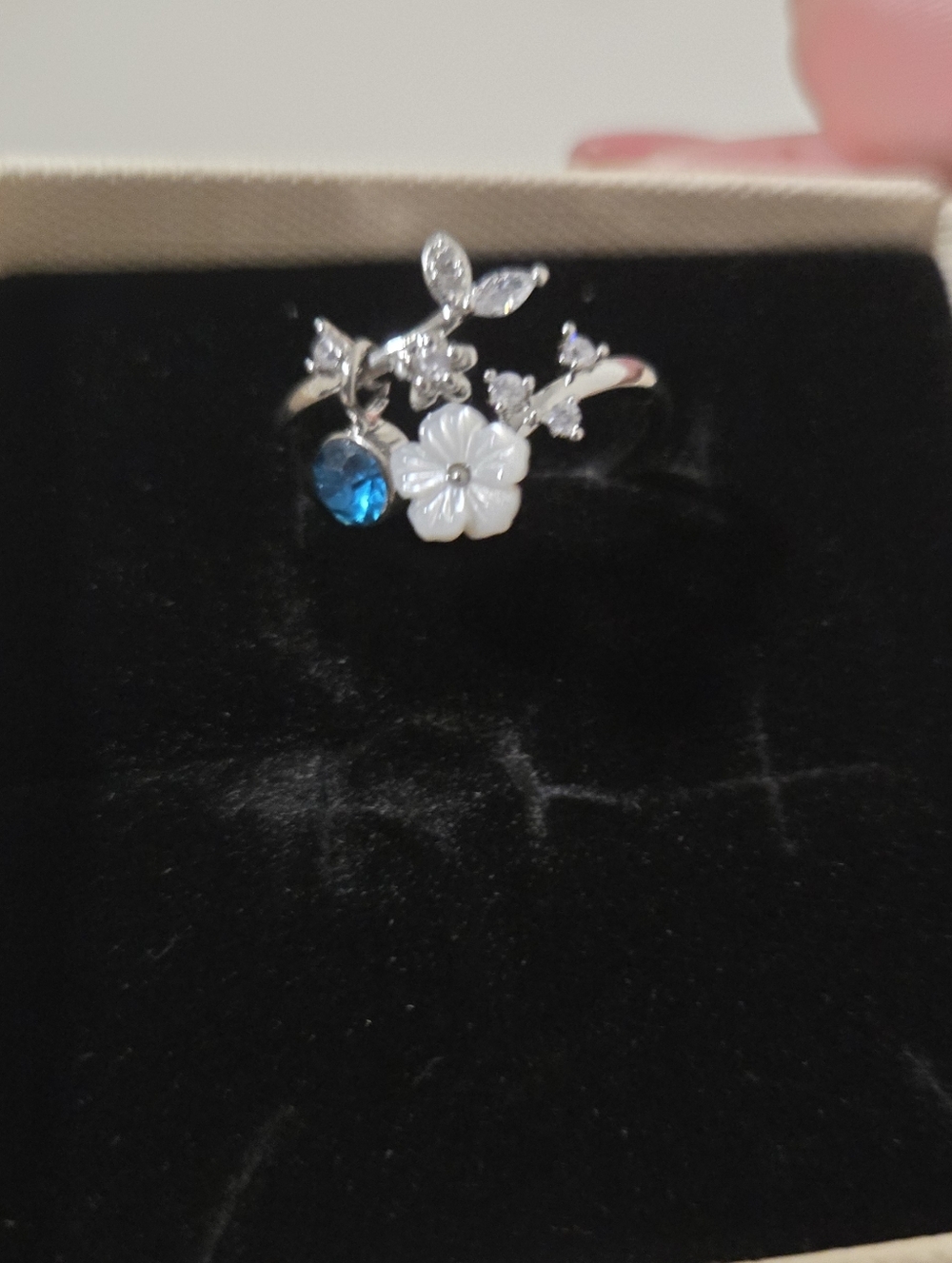 Silver Floral Birthstone Ring with Blue Topez and White Flower - Picture 3 of 6